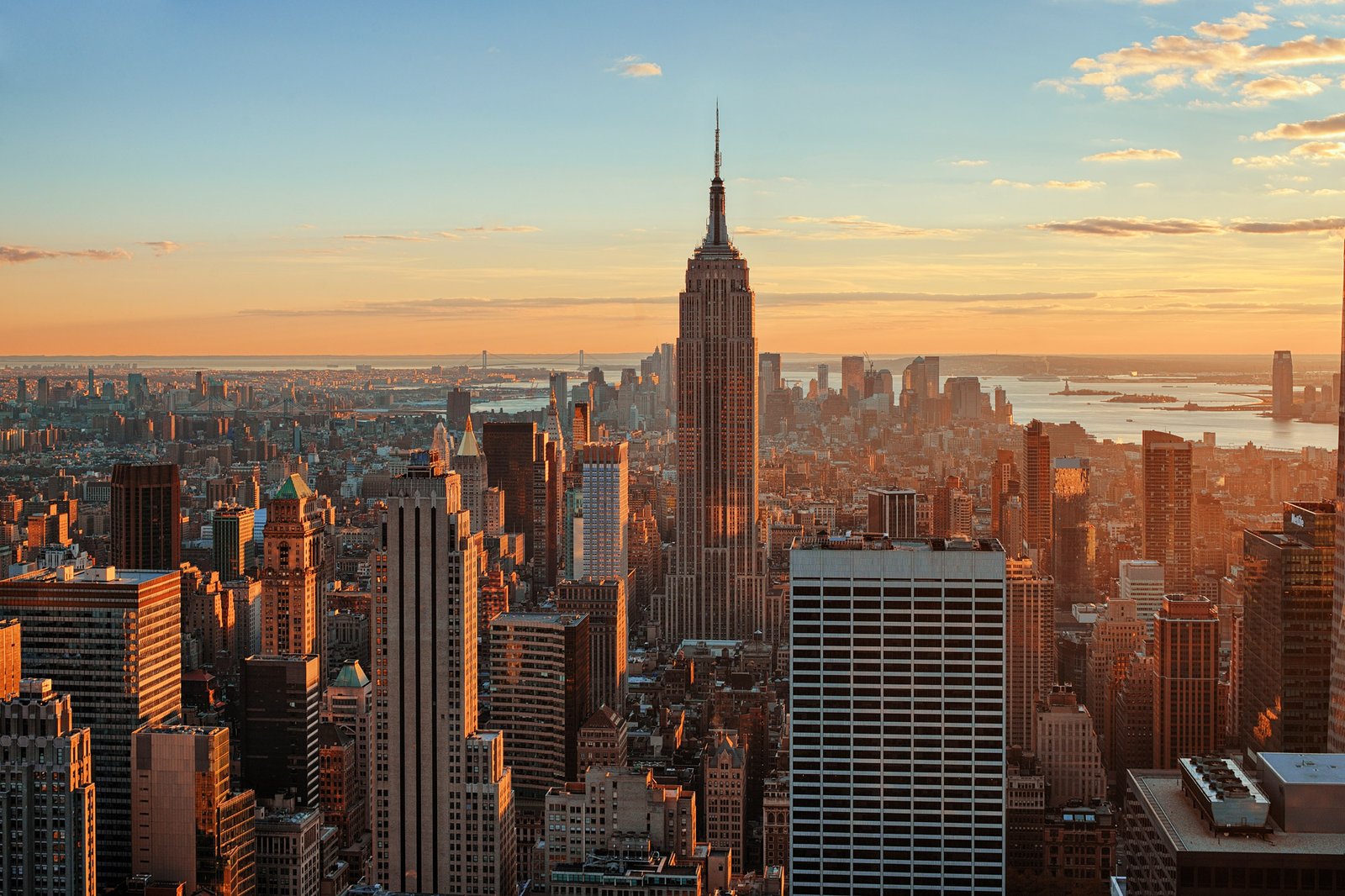 Manhattan skyline at golden hour with the Empire State Building at the center