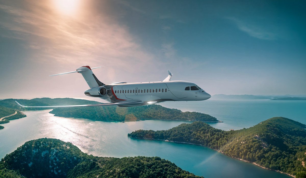Private jet in flight over a lake and forested islands