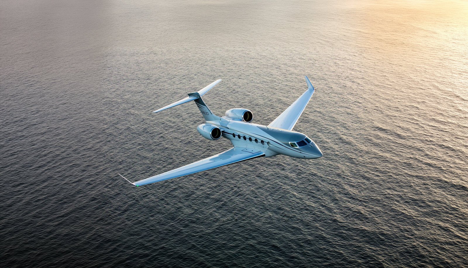 Gulfstream G600 in flight over water