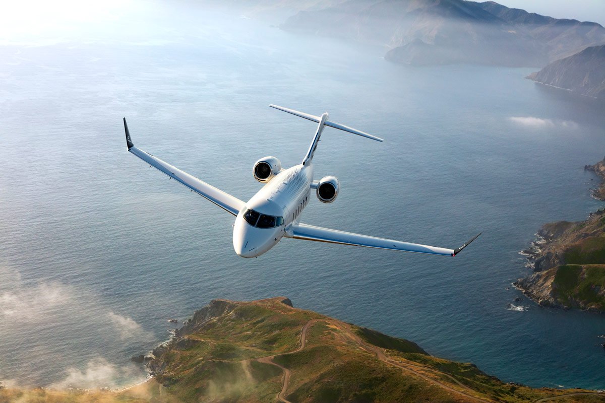 Bombardier Challenger 3500 in flight over the ocean