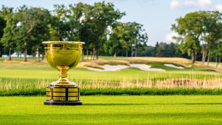 Presidents Cup trophy beside a fairway at a championship golf course