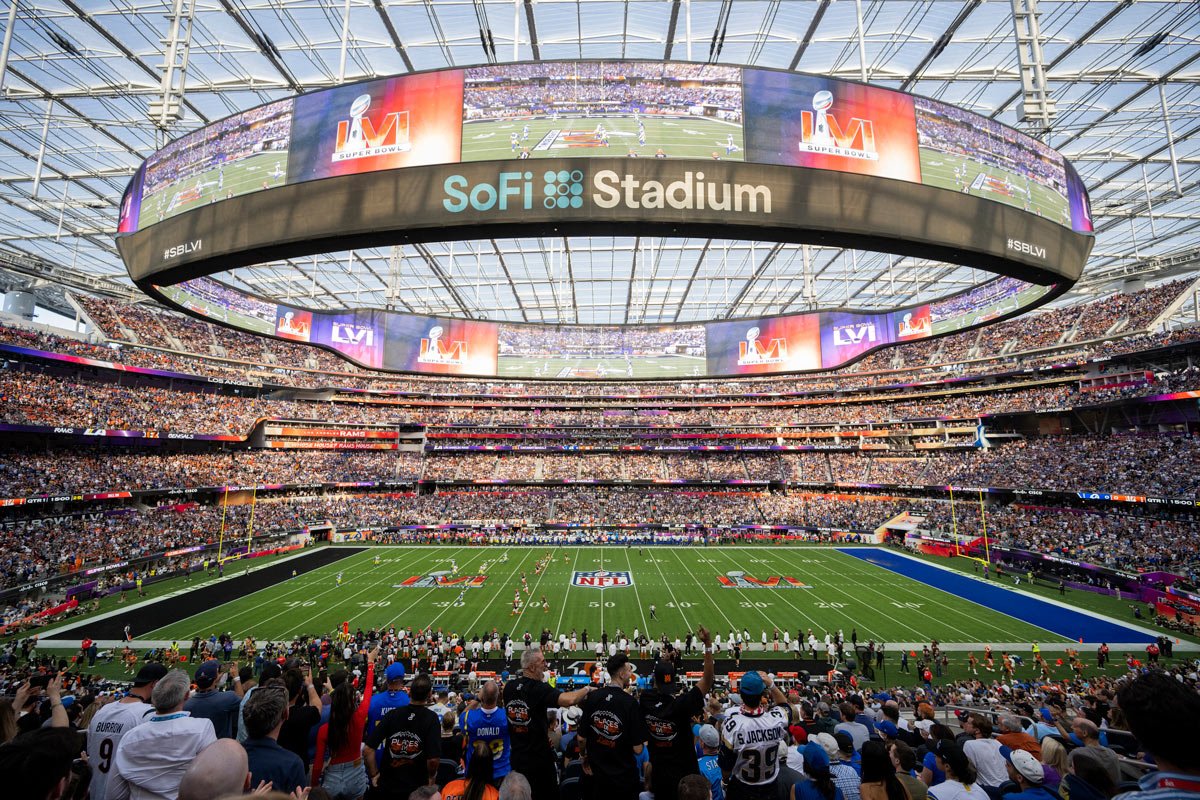 Packed SoFi Stadium during a night NFL game seen from the upper deck